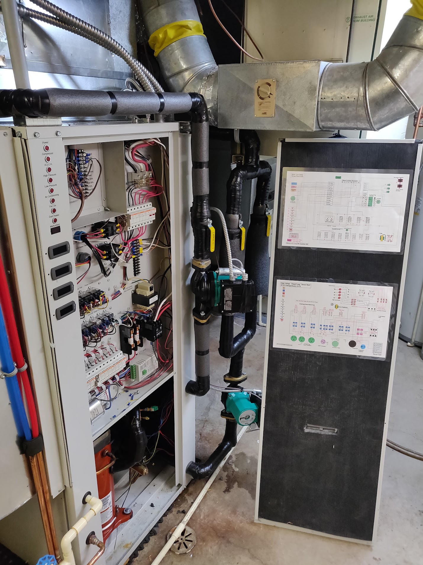 Service-side interior of a legacy vertical cabinet; used to inform the build layers.; exact model unconfirmed